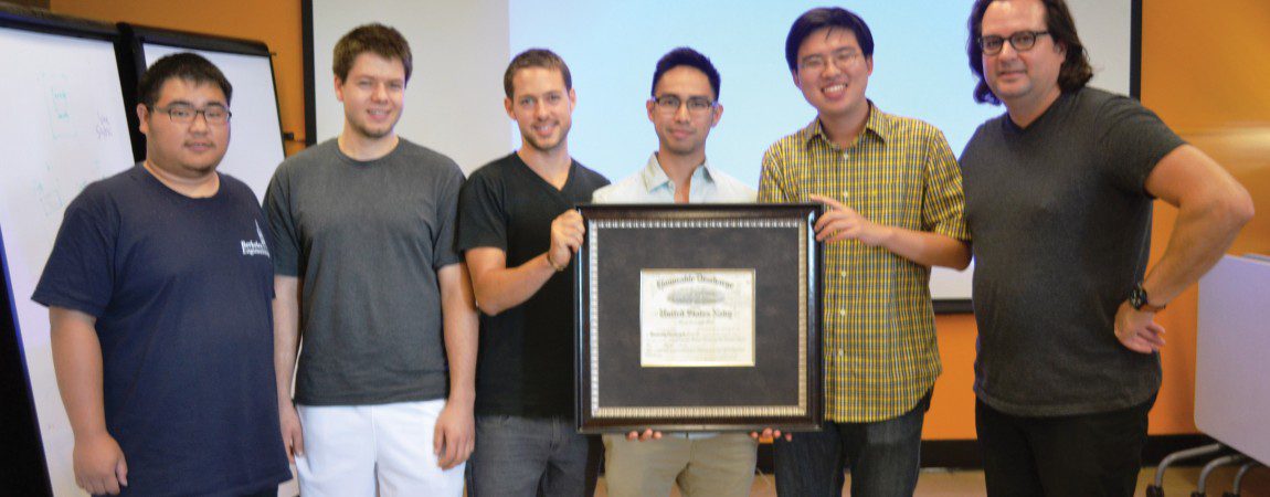 group photo of a Capstone team with an award certificate