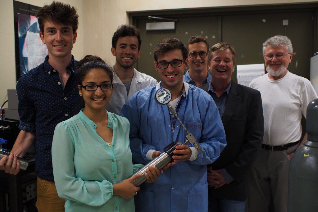 a group posing with a medical object