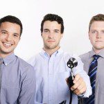 three men holding a stethoscope