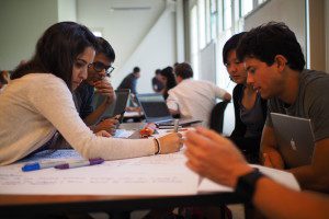students working together over a table