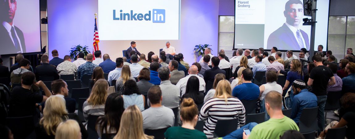 two men speaking on a LinkedIn panel