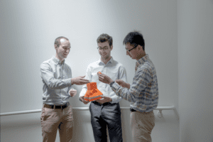 students holding a prototype