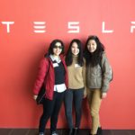 MEng students posing with Tesla sign