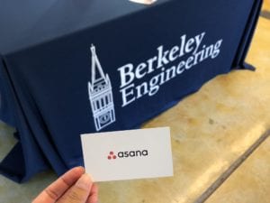 Card with the company name Asana in front of Berkeley Engineering banner