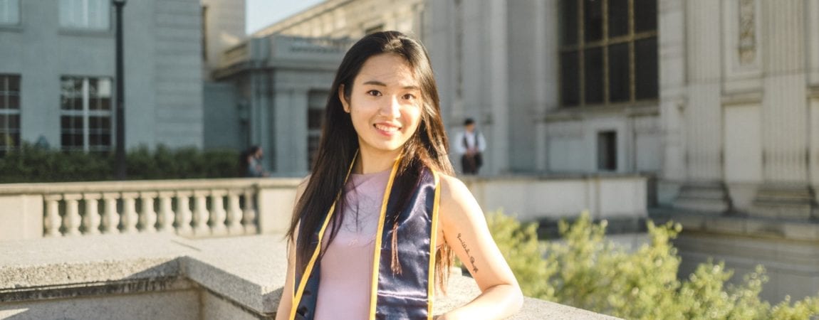 Christy Chen headshot, posing in front of Doe Library