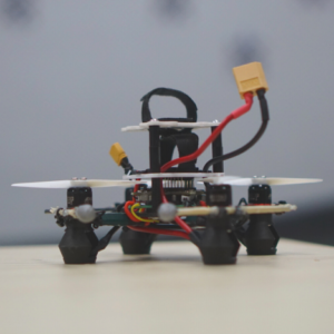 A drone sitting on a flat surface.