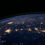 The surface of Earth as viewed from space at night.