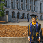 Eric Wu in graduation regalia in front of Wheeler Hall on the UC Berkeley campus
