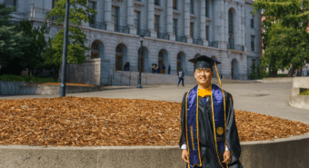 Eric Wu in graduation regalia in front of Wheeler Hall on the UC Berkeley campus